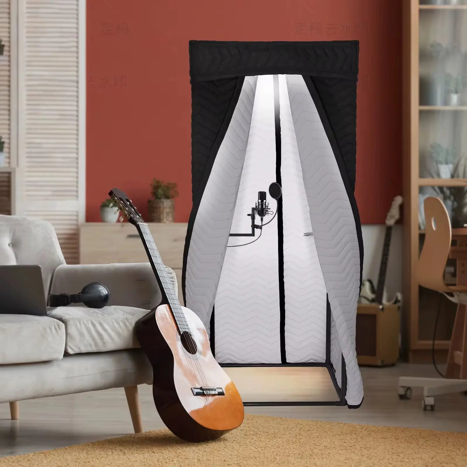 Portable vocal booth with white interior in home recording setup