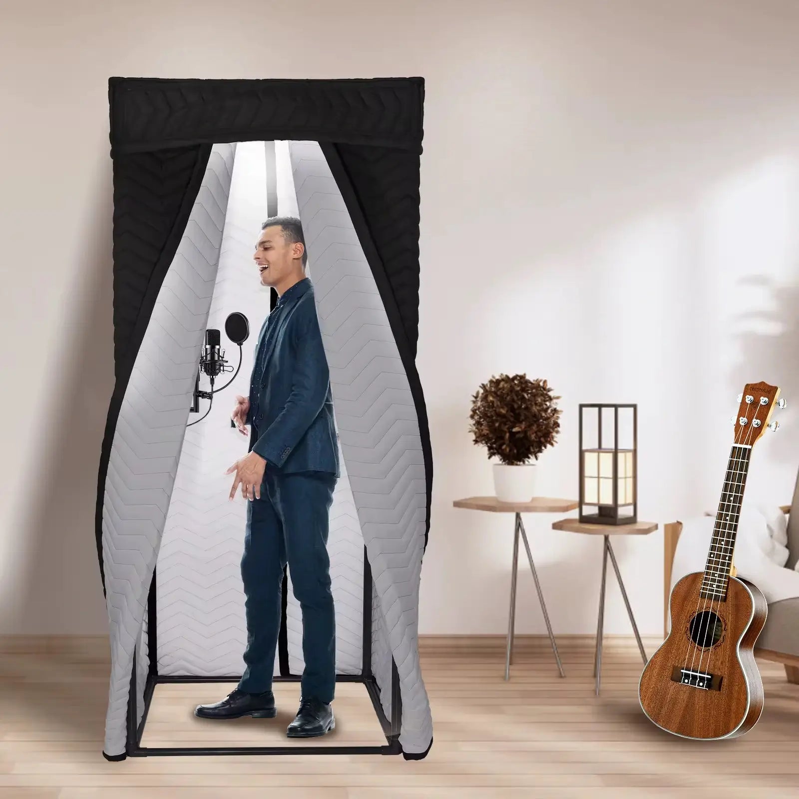 Portable vocal booth with singer inside for professional studio recording
